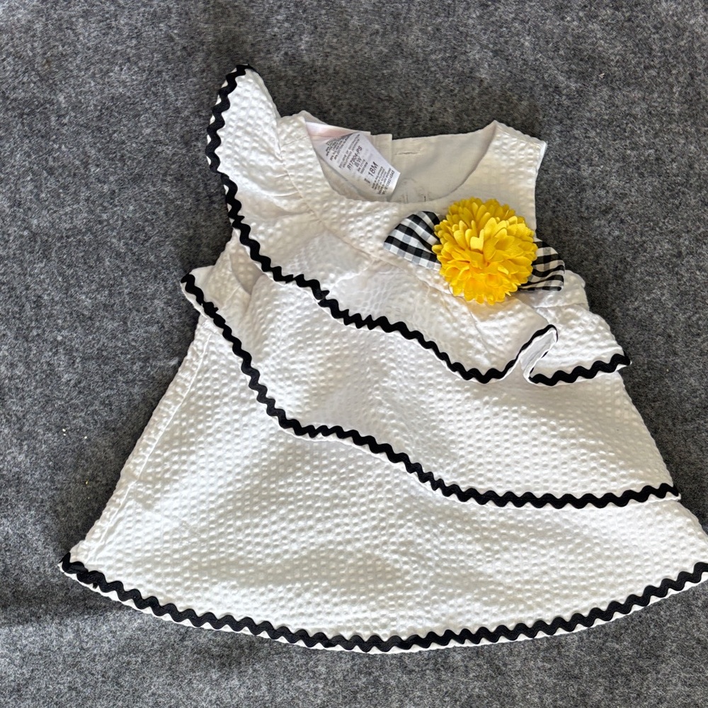 🌻Bonnie Baby White Textured Dress with Black Trim and Yellow Flower Accent